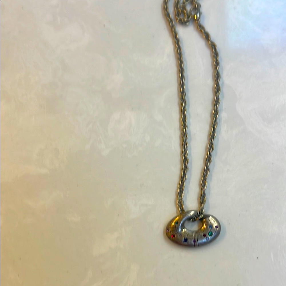 Gold plated necklace with multi colored crystals.
